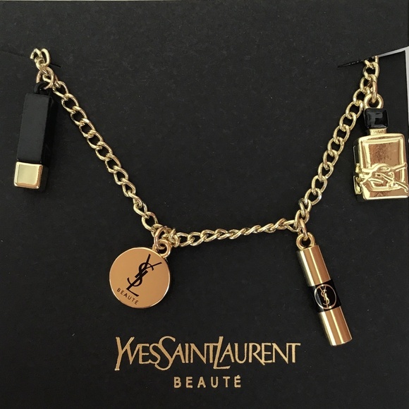 YSL Gold tone charm bracelet with four YSL charms - Picture 1 of 4
